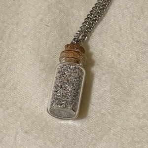 Bottle necklace with sand from the Caribbean.